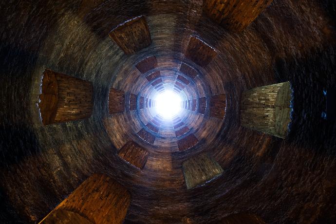 a circular wooden structure with a light